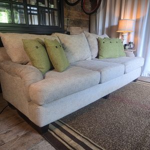 Neutral beige fabric three-seat sofa